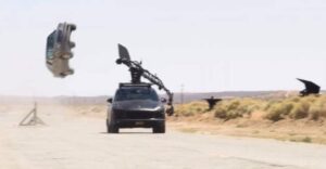 Stunt driving car drifting in the desert during a stunt driving class